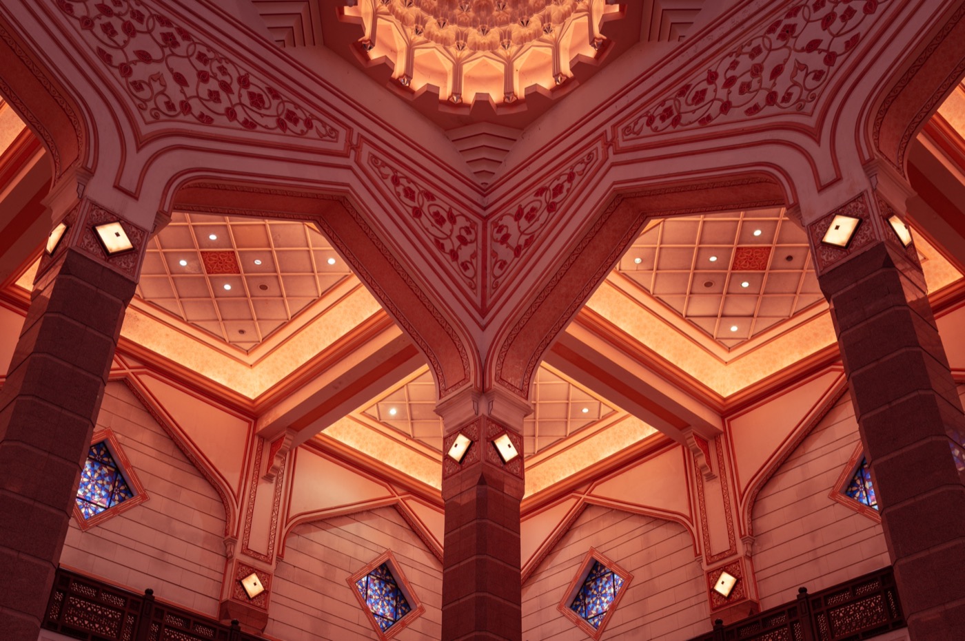 Interior of a mosque with intricate Islamic architecture